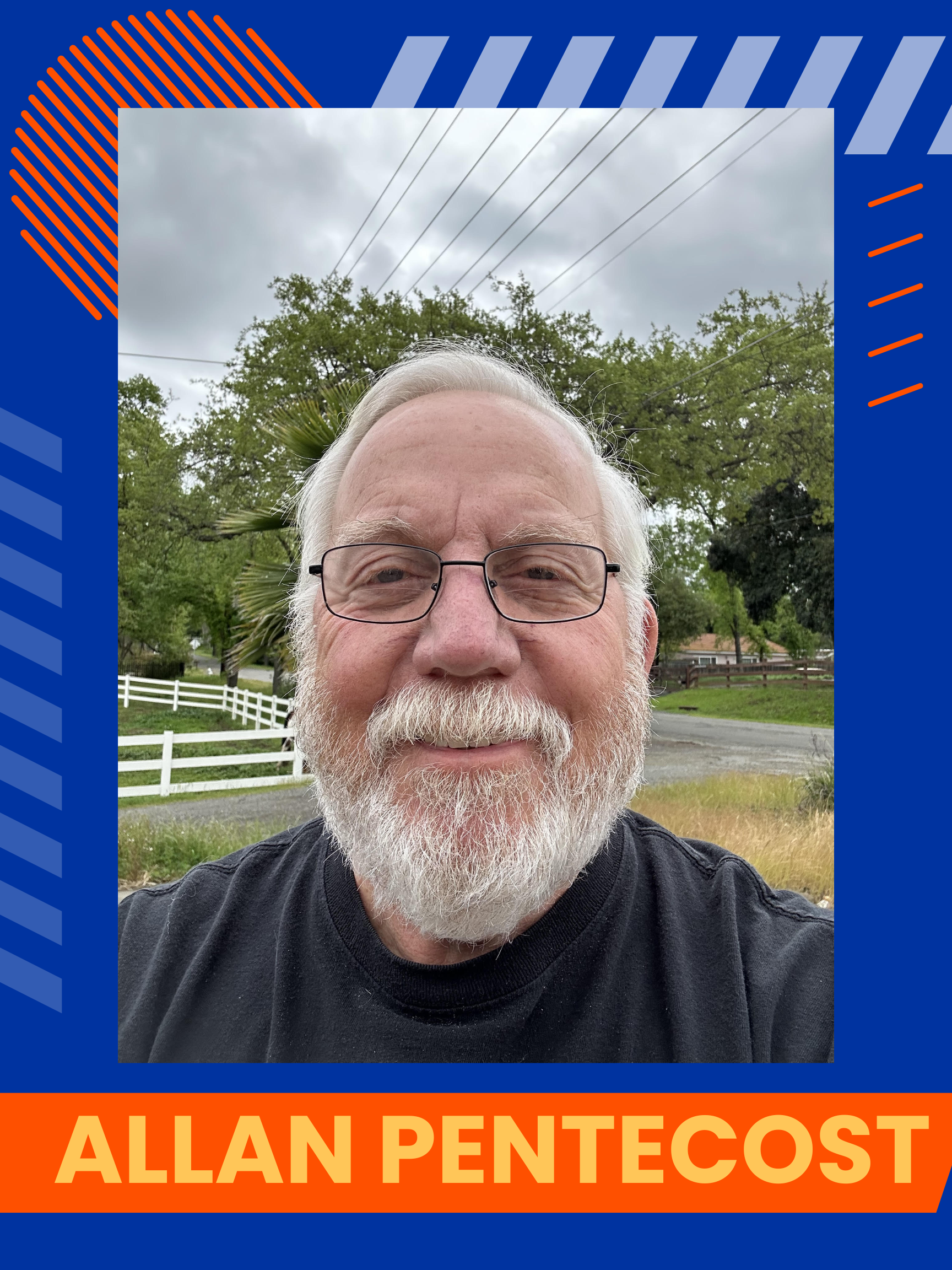 Allan Pentecost, a man wearing a black shirt and glasses. He is smiling and looking at the camera.