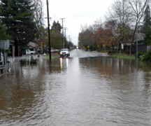 Flooding residential street with vehicle