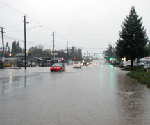 Auburn Boulevard Flooded - flooded street with several vehicles in water